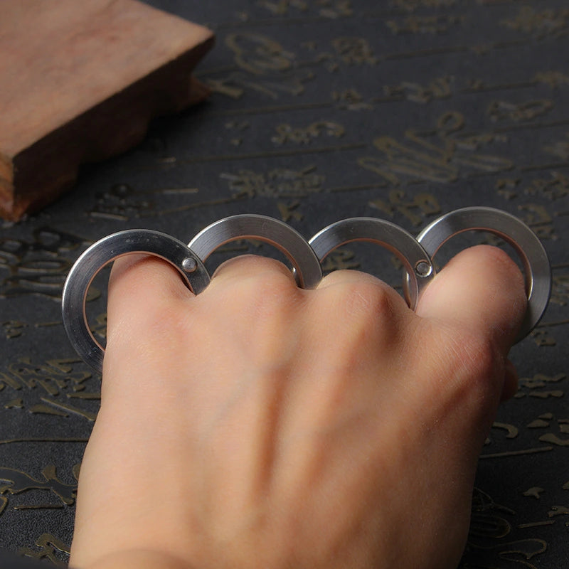 Four-finger brass knuckles
