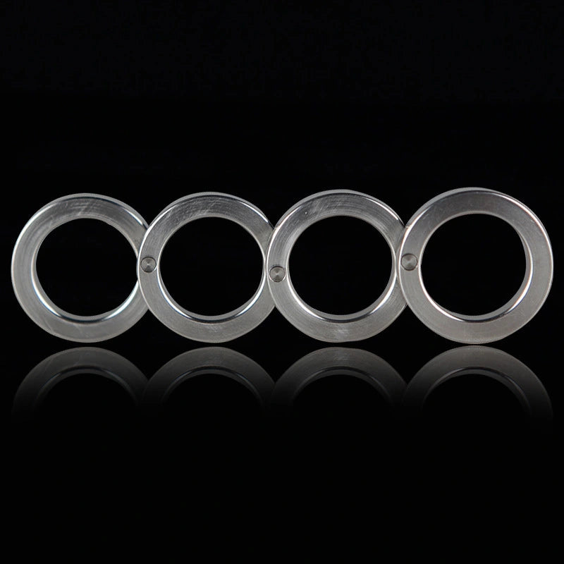 Four-finger brass knuckles